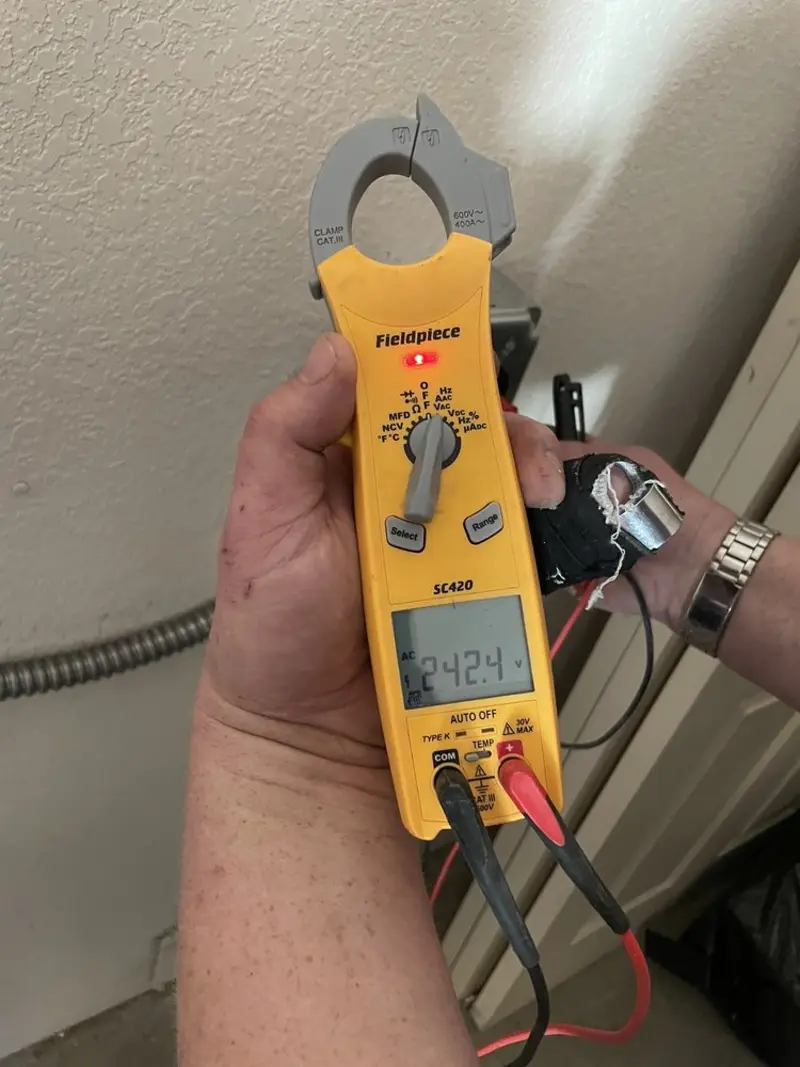 Voltage testing with clamp meter during Ceiling Fan Installation in Lake Stevens